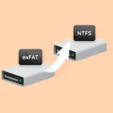 Strzałka wskazuje migrację danych z exFAT na dysk NTFS.
