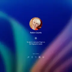 Ekran logowania Windows Hello z uśmiechniętą użytkowniczką Robin Counts, gotową do zeskanowania odcisku palca.