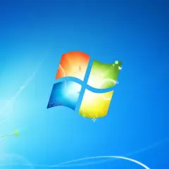 Ikona systemu Windows 7 na niebieskim tle z delikatnymi, świetlistymi liniami i motylami.