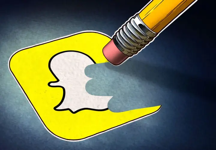 Ołówek z gumką wymazuje logo Snapchata, symbolizując, jak usunąć konto na Snapie.