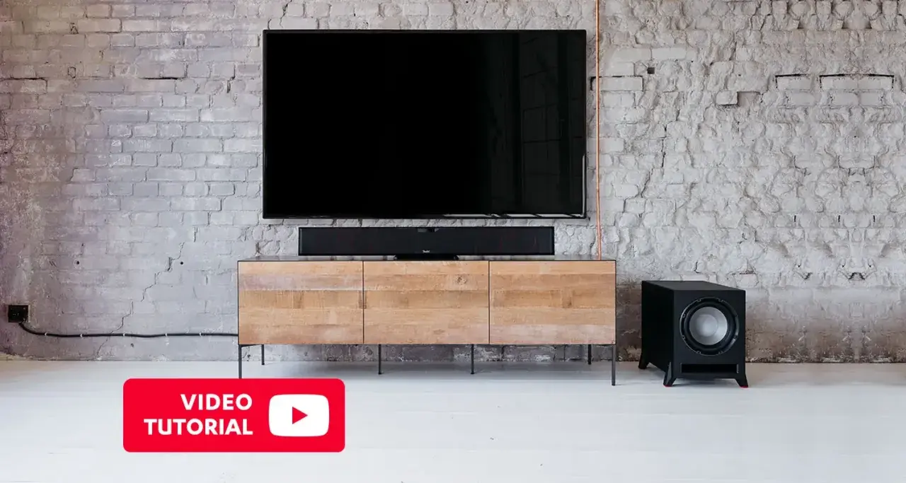Dowiedz się, jak podłączyć głośniki do subwoofera, aby uzyskać głęboki bas. Wideo tutorial pokazuje konfigurację kina domowego.