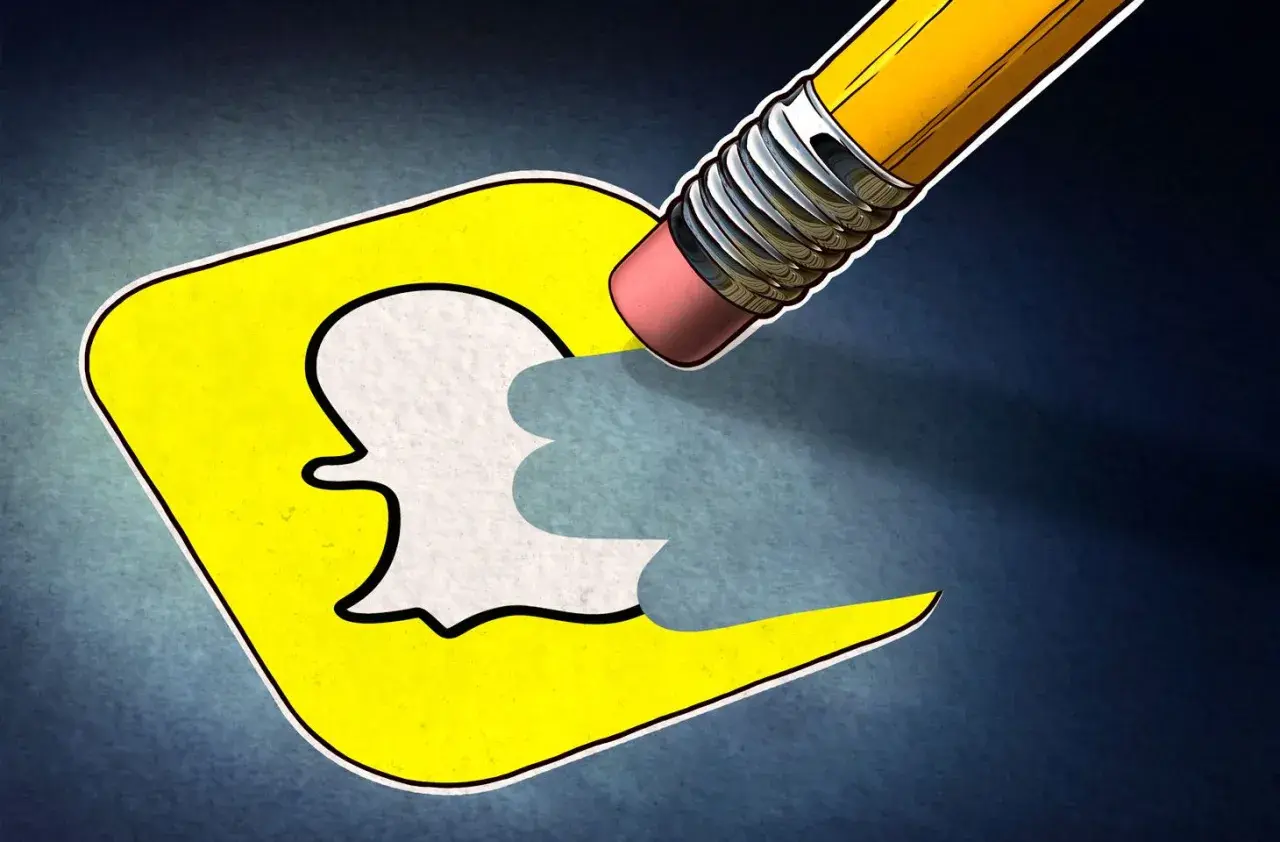 Ołówek z gumką wymazuje logo Snapchata, symbolizując, jak usunąć konto na Snapie.